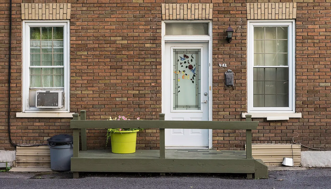 House front with a green porch, Vieux Limoilou